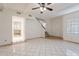 Spacious living room features a cozy fireplace, tile flooring, stairs, and access to the kitchen at 1446 E Grovers Ave # 13, Phoenix, AZ 85022