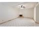 Spacious living room features a cozy fireplace, tile flooring, and bright natural light from a large window at 1446 E Grovers Ave # 13, Phoenix, AZ 85022
