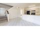 Open living space featuring tile flooring, neutral walls, and an adjacent kitchen at 1446 E Grovers Ave # 13, Phoenix, AZ 85022