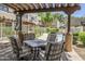 Inviting patio features a dining set and shade, ideal for outdoor dining and relaxation at 1446 E Grovers Ave # 13, Phoenix, AZ 85022