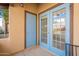 Outdoor patio with colorful doors that allow natural light inside the house at 1446 E Grovers Ave # 13, Phoenix, AZ 85022