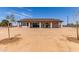 Spacious backyard with a covered patio, perfect for outdoor activities and enjoying the desert landscape at 20310 W Hubbard Rd, Buckeye, AZ 85326
