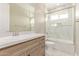 Bathroom featuring a large vanity, shower over tub and a modern sink at 20310 W Hubbard Rd, Buckeye, AZ 85326