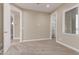 Neutral bedroom featuring carpet flooring and ensuite bathroom at 20310 W Hubbard Rd, Buckeye, AZ 85326