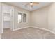 Bedroom featuring neutral walls, carpet flooring, a ceiling fan, and a walk-in closet for ample storage at 20310 W Hubbard Rd, Buckeye, AZ 85326