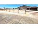 Single story home boasting neutral exterior, attached garage, and large fully fenced yard at 20310 W Hubbard Rd, Buckeye, AZ 85326