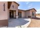 Charming single-story home with neutral stucco exterior, front yard and long driveway at 20310 W Hubbard Rd, Buckeye, AZ 85326
