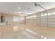 Spacious three car garage with epoxy flooring at 20310 W Hubbard Rd, Buckeye, AZ 85326
