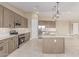 Beautiful open kitchen featuring stainless steel appliances, stylish cabinetry, and a large island at 20310 W Hubbard Rd, Buckeye, AZ 85326
