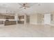 Spacious open concept with a kitchen island, stainless appliances, and ample cabinet space at 20310 W Hubbard Rd, Buckeye, AZ 85326