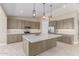 Open kitchen with a large island, stainless steel appliances, and plenty of cabinet space at 20310 W Hubbard Rd, Buckeye, AZ 85326