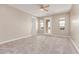 Spacious main bedroom with carpet flooring, ceiling fan, and a private patio door at 20310 W Hubbard Rd, Buckeye, AZ 85326