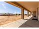 Inviting covered patio with a spacious backyard, ideal for outdoor entertaining and relaxation at 20310 W Hubbard Rd, Buckeye, AZ 85326