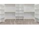 Spacious walk-in closet with ample shelving and carpeted flooring for organized storage at 20310 W Hubbard Rd, Buckeye, AZ 85326