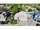 Stunning aerial view of a home showcasing its manicured lawn, refreshing pool, and three-car garage in a friendly neighborhood at 25015 N 50Th Ave, Phoenix, AZ 85083