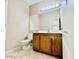 Cozy bathroom features tile flooring and a wood vanity for storage and convenience at 25015 N 50Th Ave, Phoenix, AZ 85083