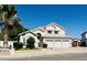 Charming two-story home with a three-car garage, a well-manicured lawn, and mature landscaping at 25015 N 50Th Ave, Phoenix, AZ 85083