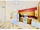 Bright kitchen featuring granite countertops, a large refrigerator, and a full-sized oven at 25015 N 50Th Ave, Phoenix, AZ 85083