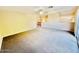 Spacious carpeted open floor plan living room with sliding glass doors at 25015 N 50Th Ave, Phoenix, AZ 85083