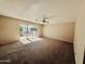 Spacious living room with sliding glass doors and neutral color palette offers a bright and airy ambiance at 25015 N 50Th Ave, Phoenix, AZ 85083