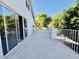 A cozy patio with white railings and large sliding glass doors offers outdoor living space at 25015 N 50Th Ave, Phoenix, AZ 85083