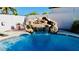 Gorgeous pool with a rock waterfall feature, perfect for relaxing and entertaining at 25015 N 50Th Ave, Phoenix, AZ 85083
