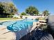 Backyard pool with waterfall feature and a built-in table with seating at 25015 N 50Th Ave, Phoenix, AZ 85083