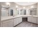 Expansive bathroom with double sinks, updated vanities, mirrors, and a walk-in shower at 26649 S Howard Dr, Sun Lakes, AZ 85248