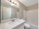 Well-lit bathroom featuring a large mirror, vanity with sink, and a shower-tub combo at 26649 S Howard Dr, Sun Lakes, AZ 85248