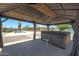Hot tub under a gazebo offering a private backyard retreat with poolside views at 26649 S Howard Dr, Sun Lakes, AZ 85248