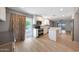 Bright kitchen showcases backyard access and offers white cabinetry, stainless appliances, and a functional island at 26649 S Howard Dr, Sun Lakes, AZ 85248