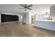 Open-concept living space with eat-in kitchen featuring stainless steel appliances and modern cabinetry at 26649 S Howard Dr, Sun Lakes, AZ 85248