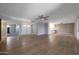 Open-concept living area with tile floors connecting to an eat-in kitchen and neutral color palette at 26649 S Howard Dr, Sun Lakes, AZ 85248