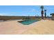 A clear backyard pool with desert landscaping provides a tranquil outdoor space at 26649 S Howard Dr, Sun Lakes, AZ 85248