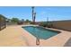 Inviting backyard features a sparkling pool, desert plants, and a covered jacuzzi at 26649 S Howard Dr, Sun Lakes, AZ 85248