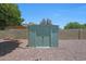 Metal storage shed in the backyard, providing extra storage space at 26649 S Howard Dr, Sun Lakes, AZ 85248