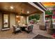 Cozy backyard patio with comfortable seating and a charming fire pit, perfect for entertaining at 28878 N 127Th Ln, Peoria, AZ 85383