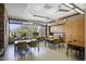 Functional conference room with abundant natural light, modern furnishings, and convenient built-in cabinets at 28878 N 127Th Ln, Peoria, AZ 85383