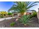 Home features beautiful desert landscaping, a spacious driveway and an attached two-car garage at 28878 N 127Th Ln, Peoria, AZ 85383