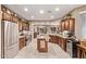 Modern kitchen with stainless steel appliances, stone countertops, and ample cabinet space at 28878 N 127Th Ln, Peoria, AZ 85383
