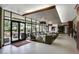 Welcoming lobby area with floor-to-ceiling windows and comfortable seating arrangement at 28878 N 127Th Ln, Peoria, AZ 85383