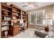 This office features a built-in bookcase, a desk, an office chair, and a comfortable armchair at 28878 N 127Th Ln, Peoria, AZ 85383