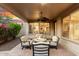Relaxing outdoor patio with a cozy fire pit and comfortable seating area at 28878 N 127Th Ln, Peoria, AZ 85383