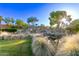 Scenic water feature with tiered waterfalls and lush landscaping for a serene setting at 28878 N 127Th Ln, Peoria, AZ 85383