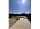 View of the backyard with low block fence, patio, and grassy areas at 3211 W Campbell Ave, Phoenix, AZ 85017