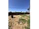 View of the backyard features a low block fence and some green grass patches at 3211 W Campbell Ave, Phoenix, AZ 85017