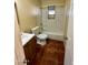 Functional bathroom features tiled walls, a tub, and a classic vanity at 3211 W Campbell Ave, Phoenix, AZ 85017