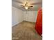A bedroom with a ceiling fan and an adjacent door to another room at 3211 W Campbell Ave, Phoenix, AZ 85017