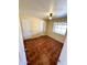Cozy bedroom with tile flooring, neutral walls, and a bright window at 3211 W Campbell Ave, Phoenix, AZ 85017