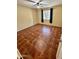 Comfortable bedroom with tile flooring, a ceiling fan, and window at 3211 W Campbell Ave, Phoenix, AZ 85017